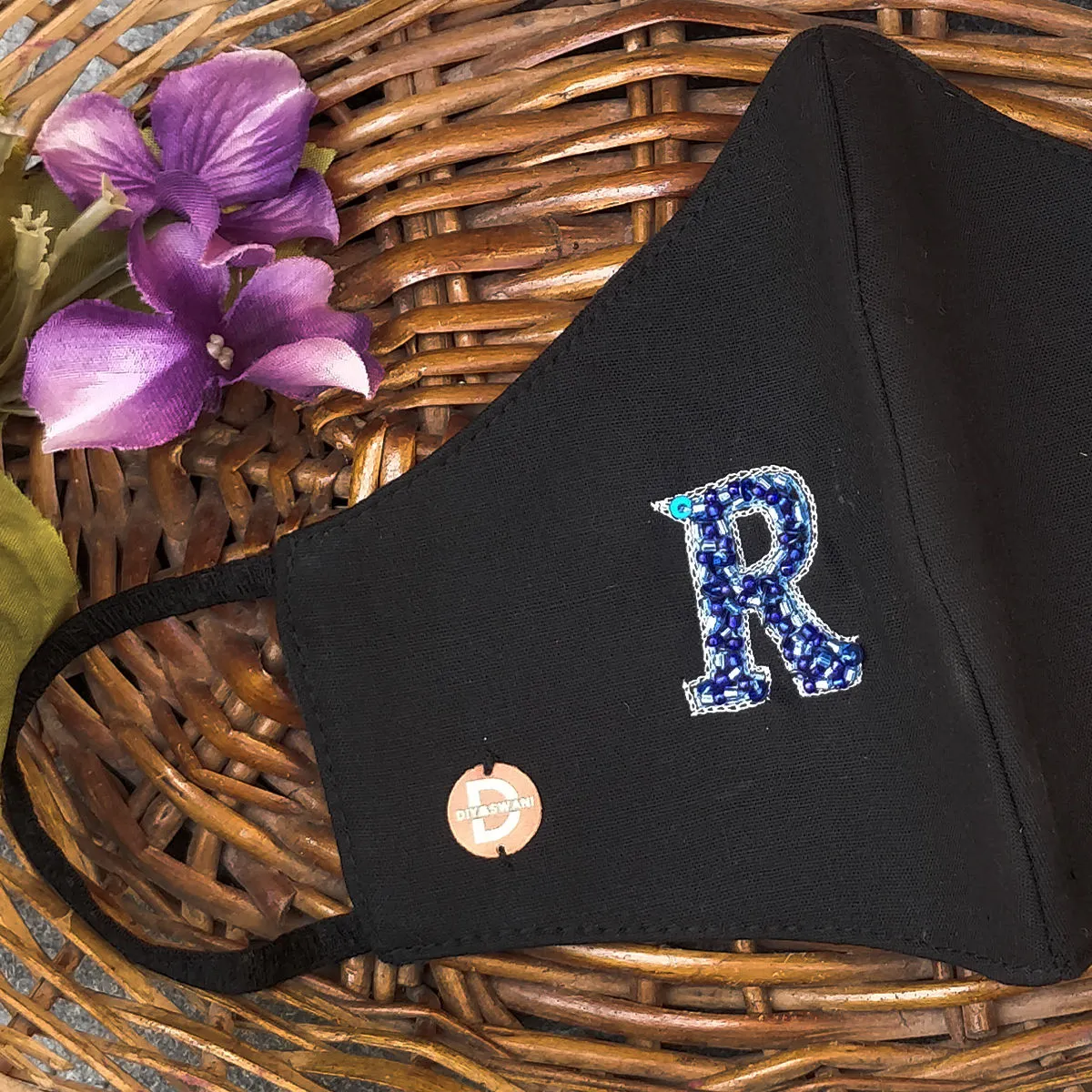 Diya Aswani Black Personalised Mask Blue Letter R