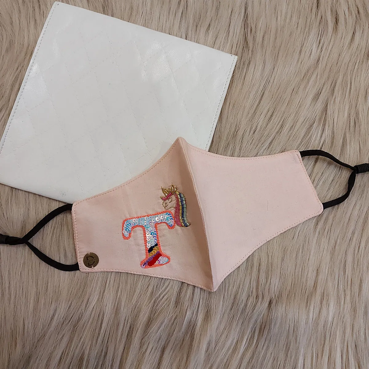 Diya Aswani Pink Unicorn Themed Letter T Mask