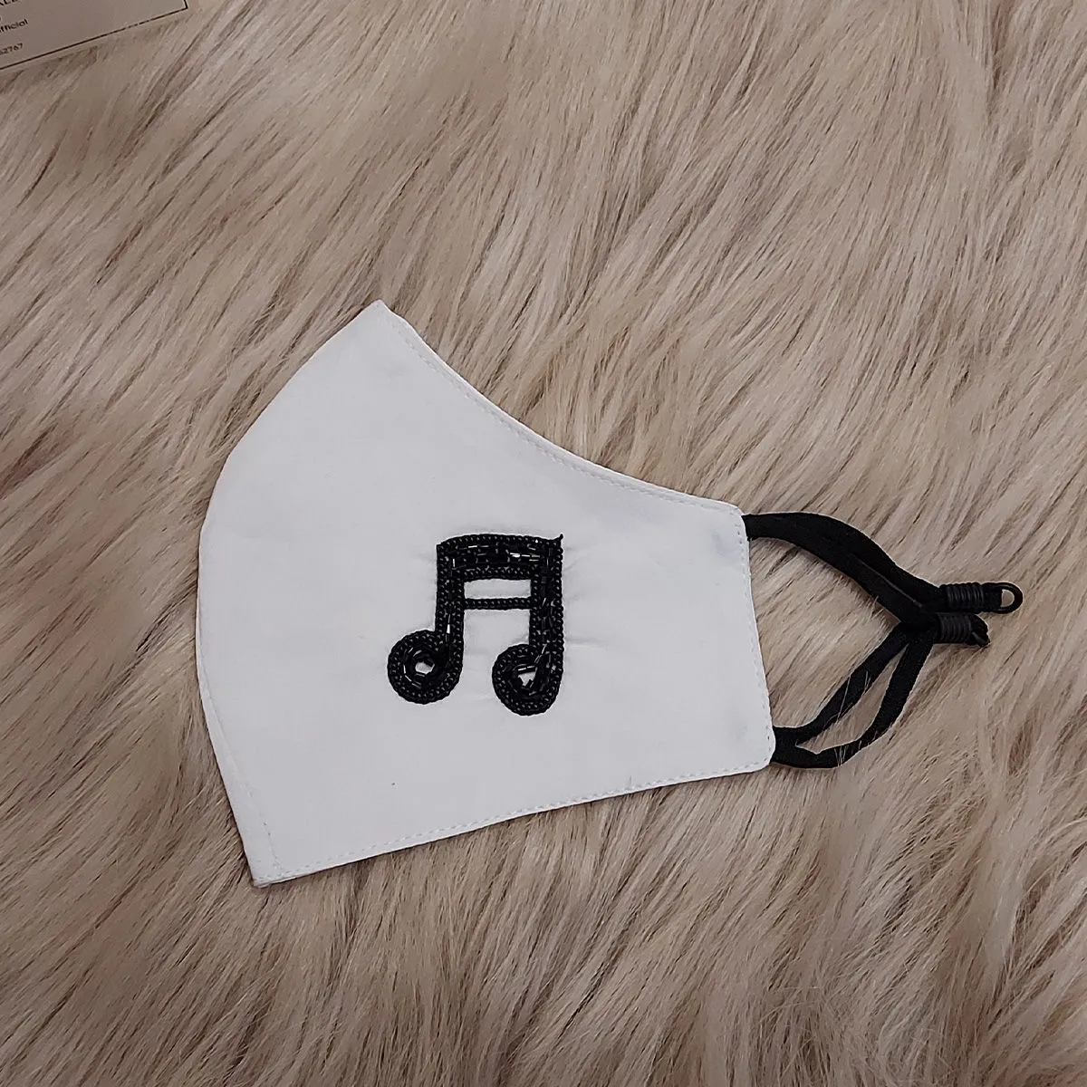 Diya Aswani White Music Note Mask